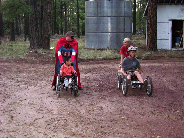 Racing with his cousins while being pushed by 'Super-Duper', a local super hero (whose secret identity is that of Kai's uncle ;-)
