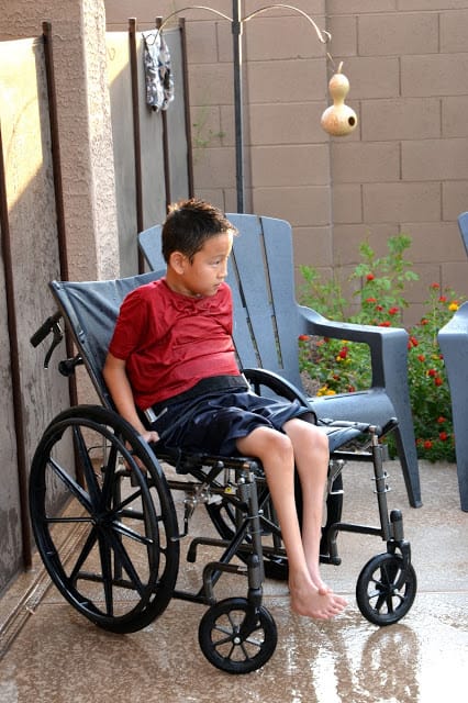 Kai can't get in the pool, but he can have fun with squirt guns