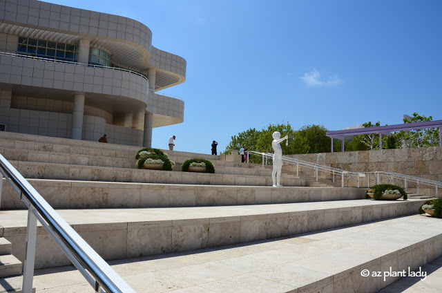 As sculpture of a boy holding a frog greets visitors to The Getty Center, Los Angeles