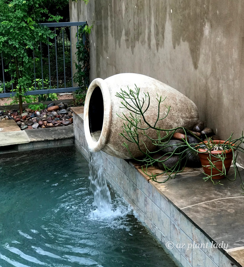 pot spills water into the swimming pool